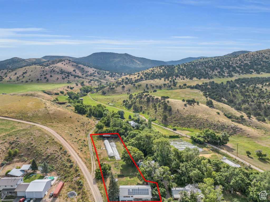 View of property location with property boundaries highlighted and a mountainous background