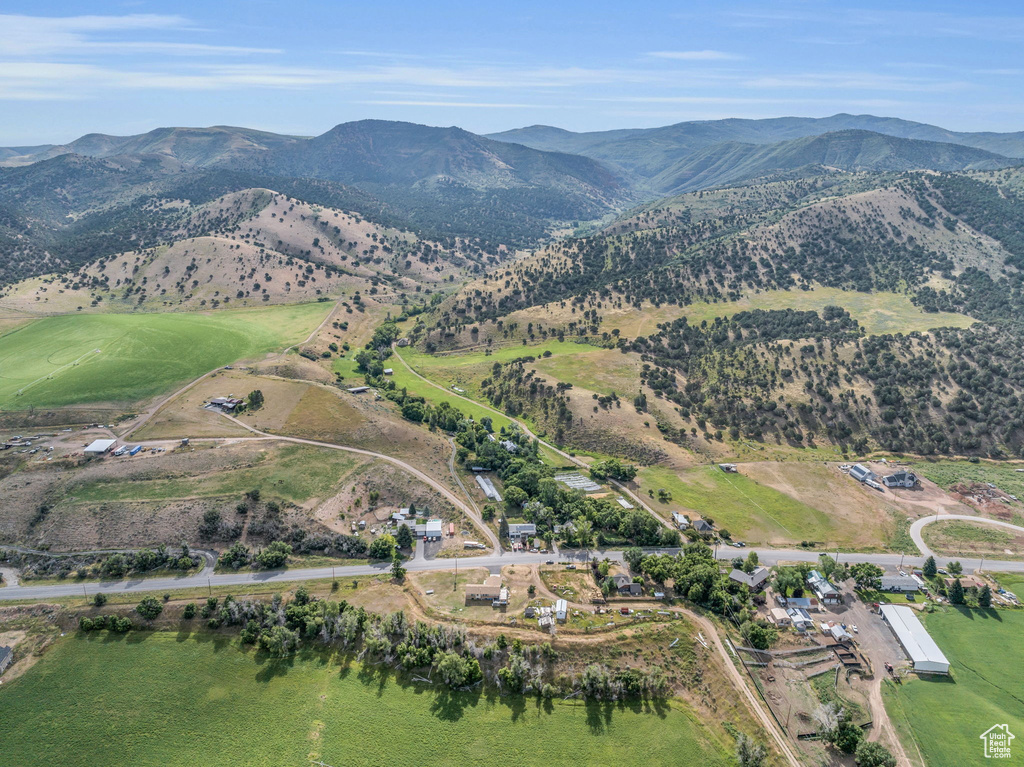 Aerial view of property's location with a mountainous background