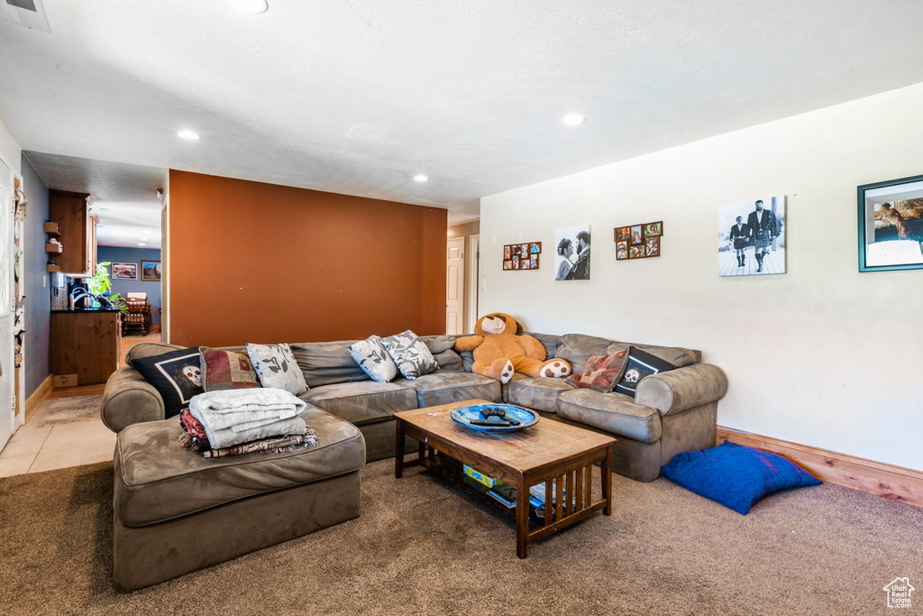Carpeted living room featuring recessed lighting