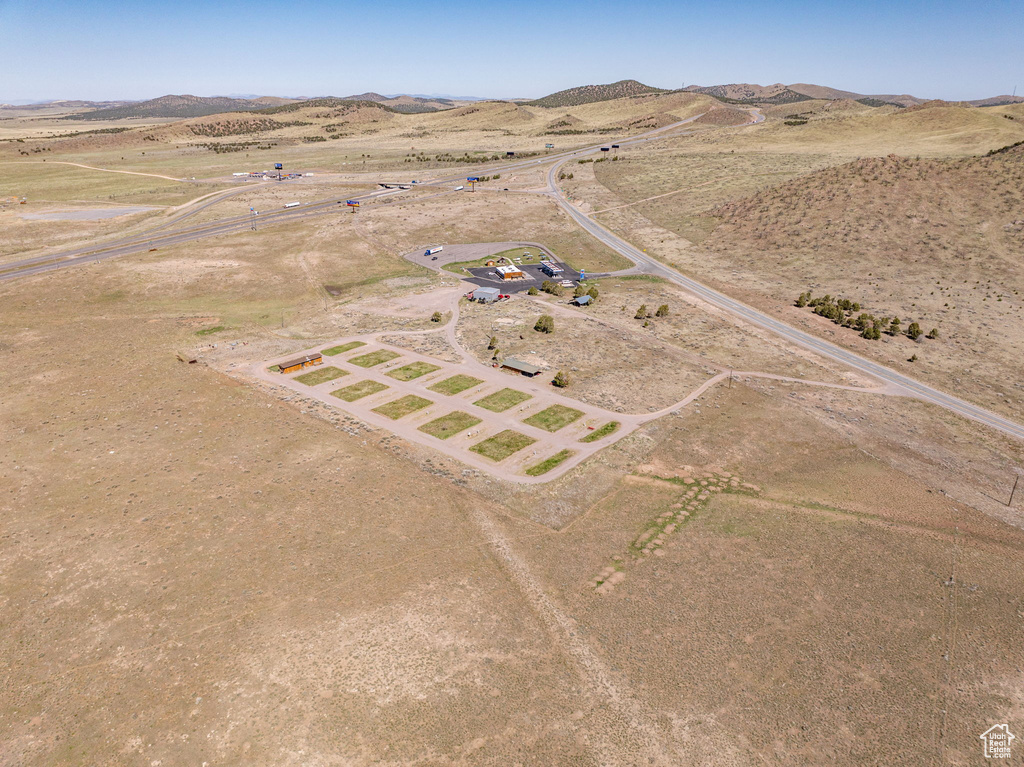 Aerial view of sparsely populated area with a mountain backdrop