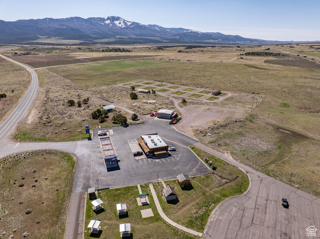 Aerial view of sparsely populated area with a mountainous background
