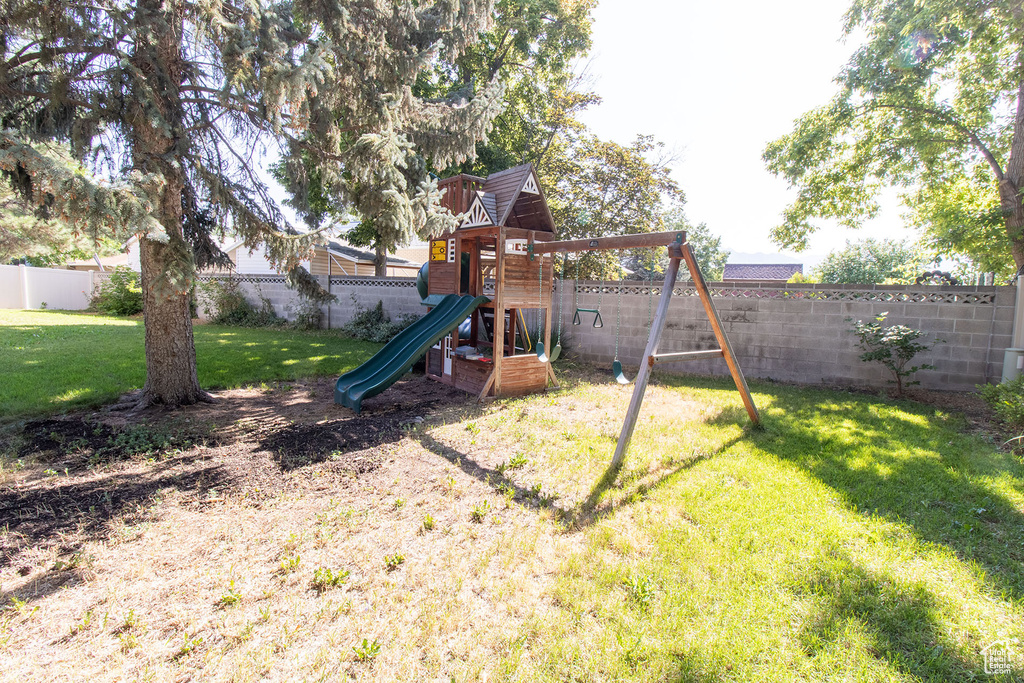 View of playground featuring a fenced backyard