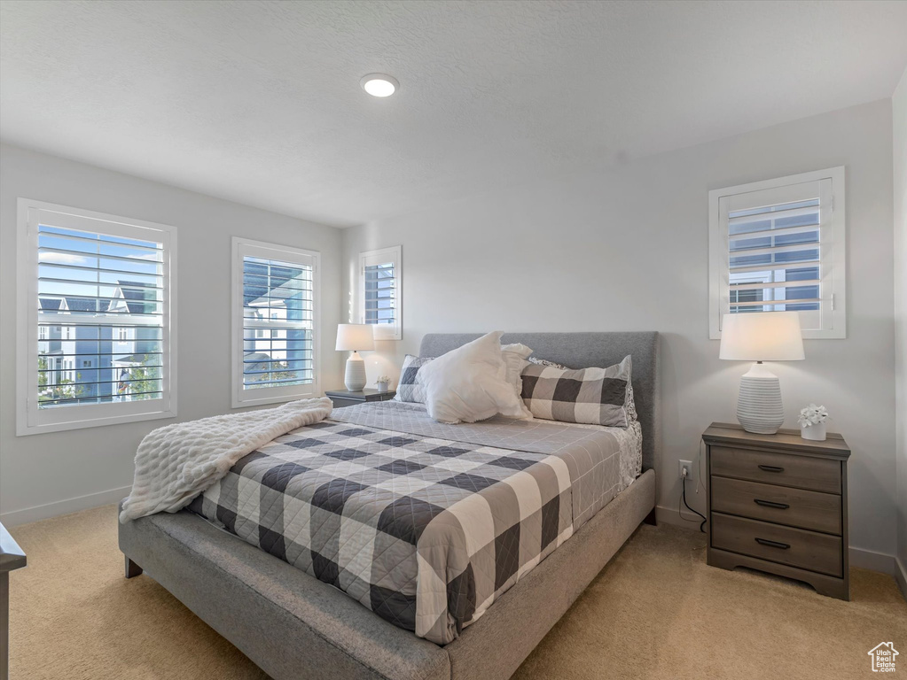 Carpeted bedroom with baseboards