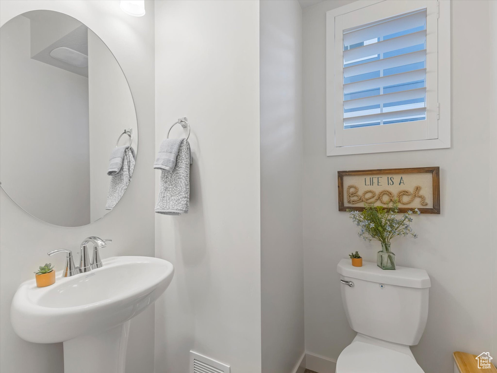 Bathroom featuring toilet and a sink
