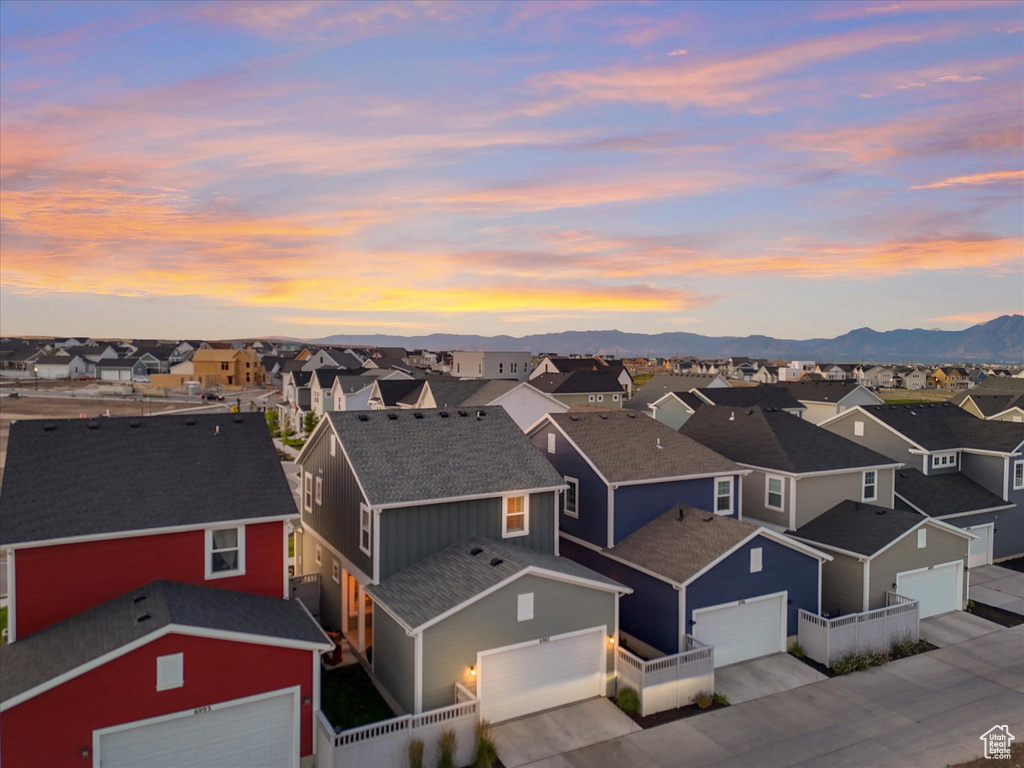 Aerial view of residential area featuring a mountainous background
