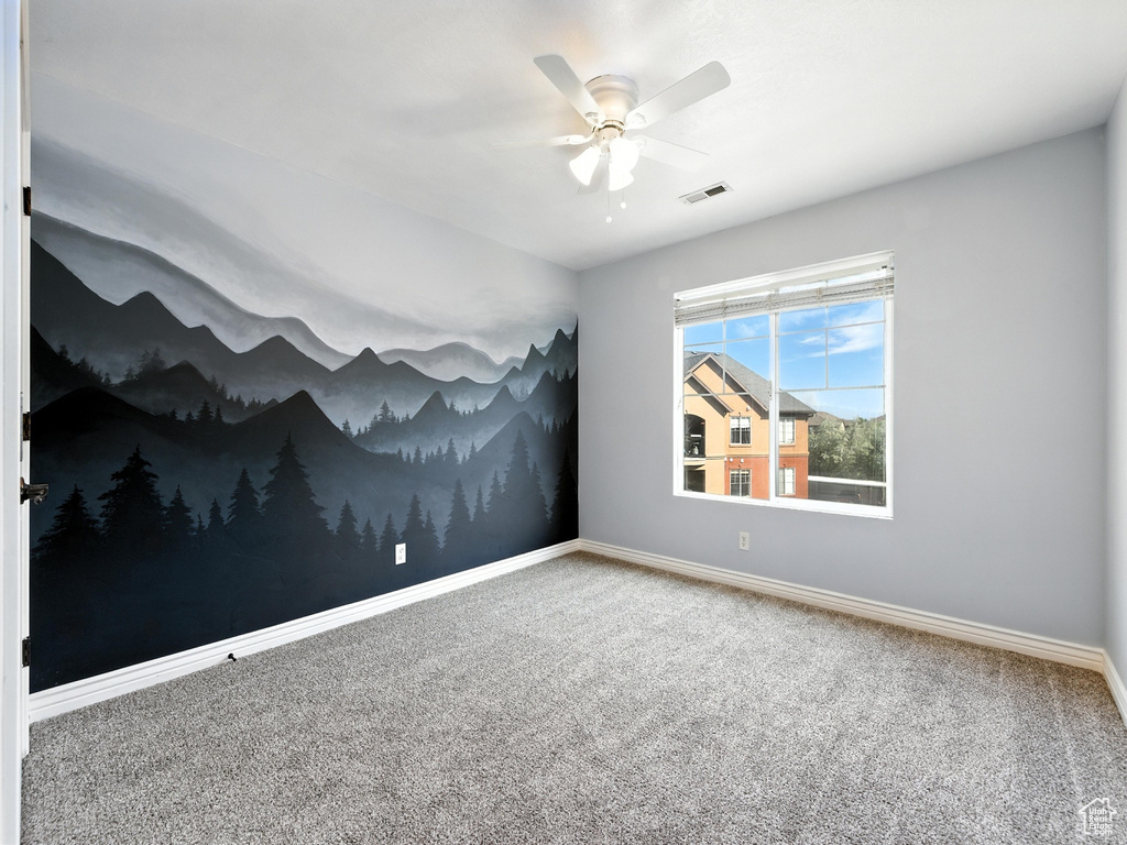 Unfurnished room with carpet flooring and ceiling fan