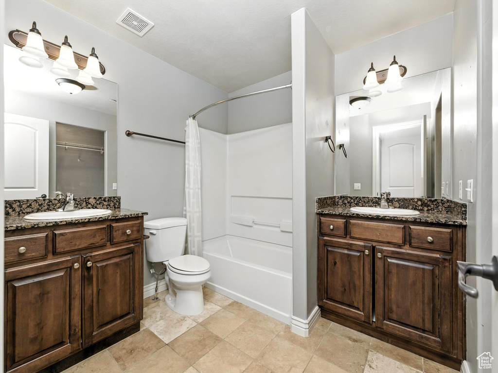 Full bathroom with vanity and shower / bathtub combination with curtain
