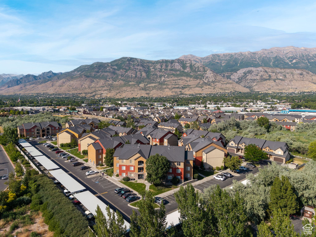 Aerial view of residential area featuring a mountainous background
