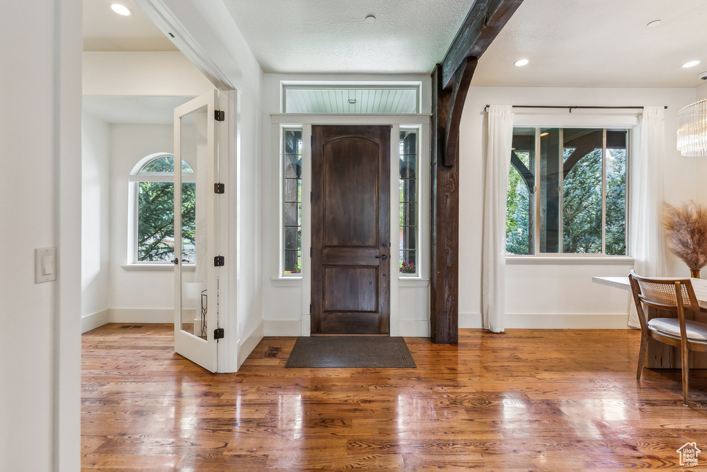 Entryway featuring wood finished floors and recessed lighting
