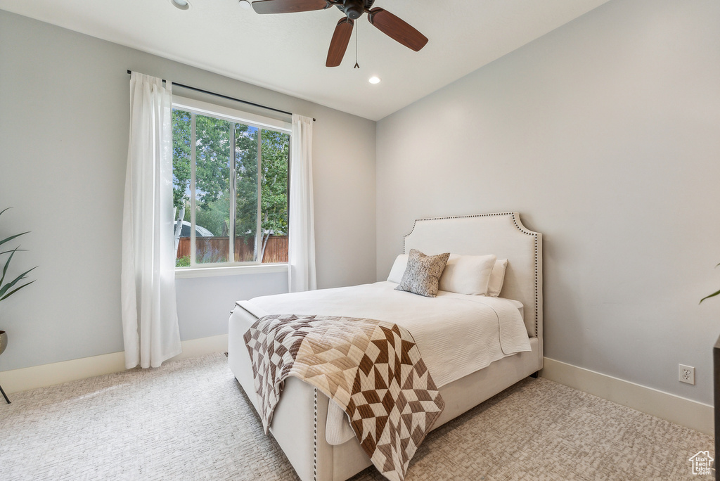 Bedroom featuring light carpet, recessed lighting, and a ceiling fan