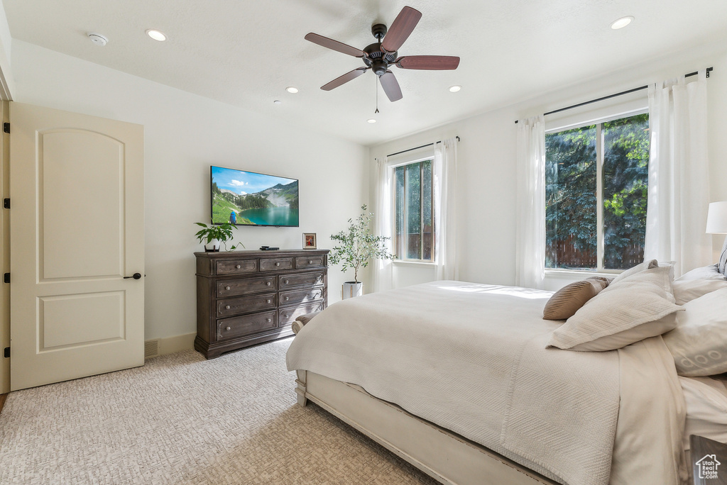 Bedroom featuring recessed lighting, light carpet, and ceiling fan