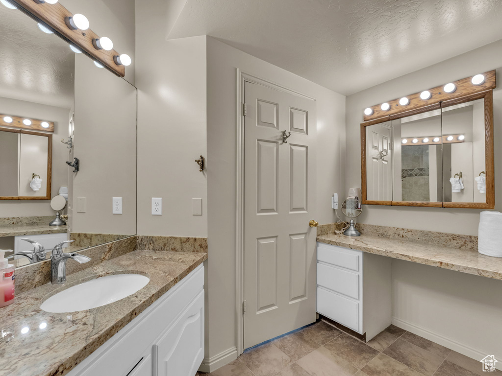 Bathroom with baseboards and vanity
