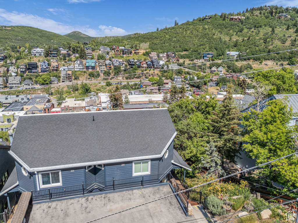 Aerial perspective of suburban area with a mountain backdrop