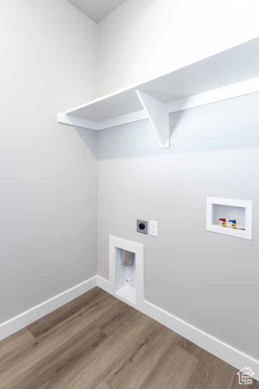 Laundry area featuring washer hookup, hookup for an electric dryer, and wood finished floors