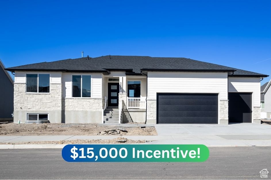 View of front of property with an attached garage, stone siding, driveway, and a shingled roof