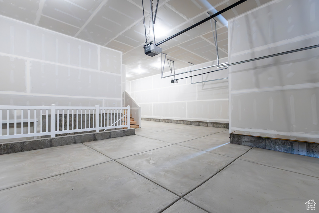 Garage featuring a garage door opener