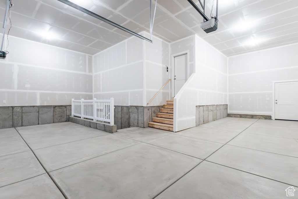 Garage featuring a garage door opener