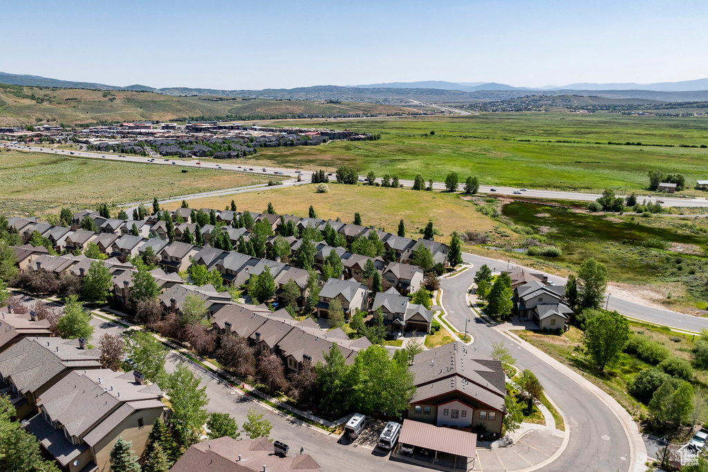 Aerial perspective of suburban area with a mountain backdrop