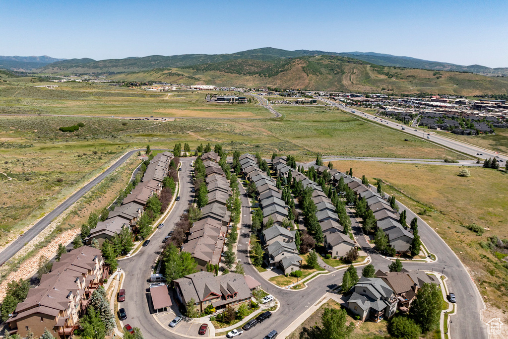 View of property location featuring nearby suburban area and a mountainous background