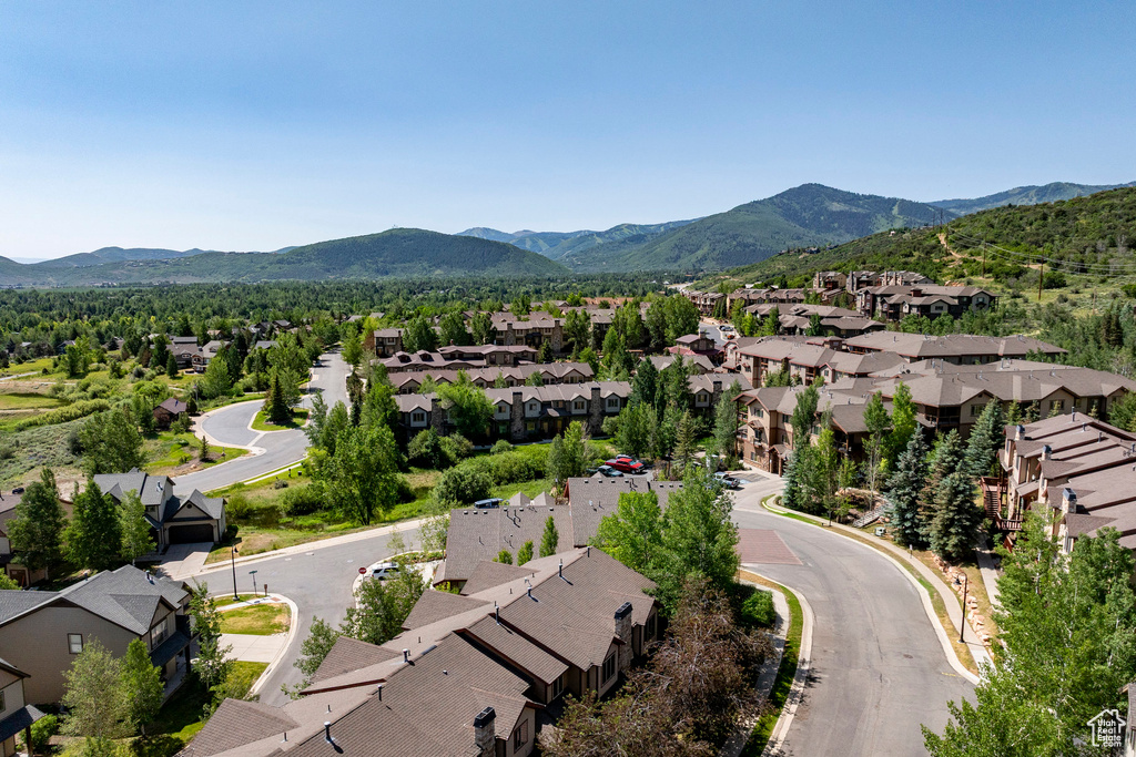 Aerial perspective of suburban area with a mountainous background