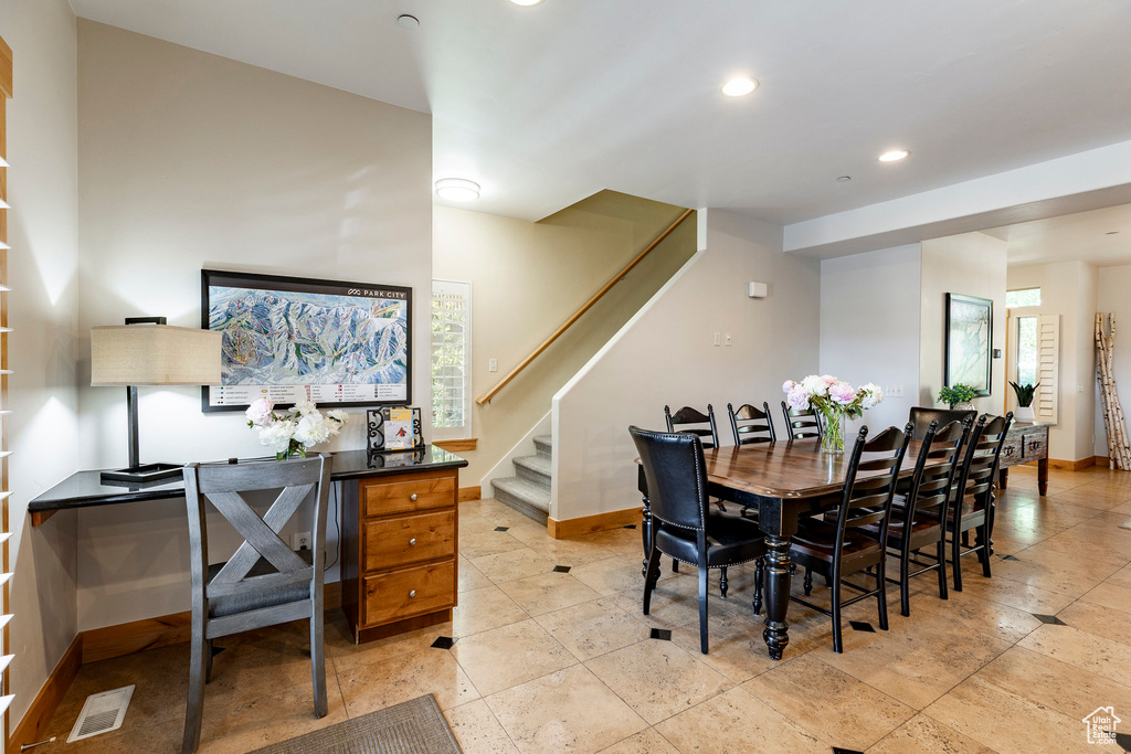 Dining area with stairway and recessed lighting