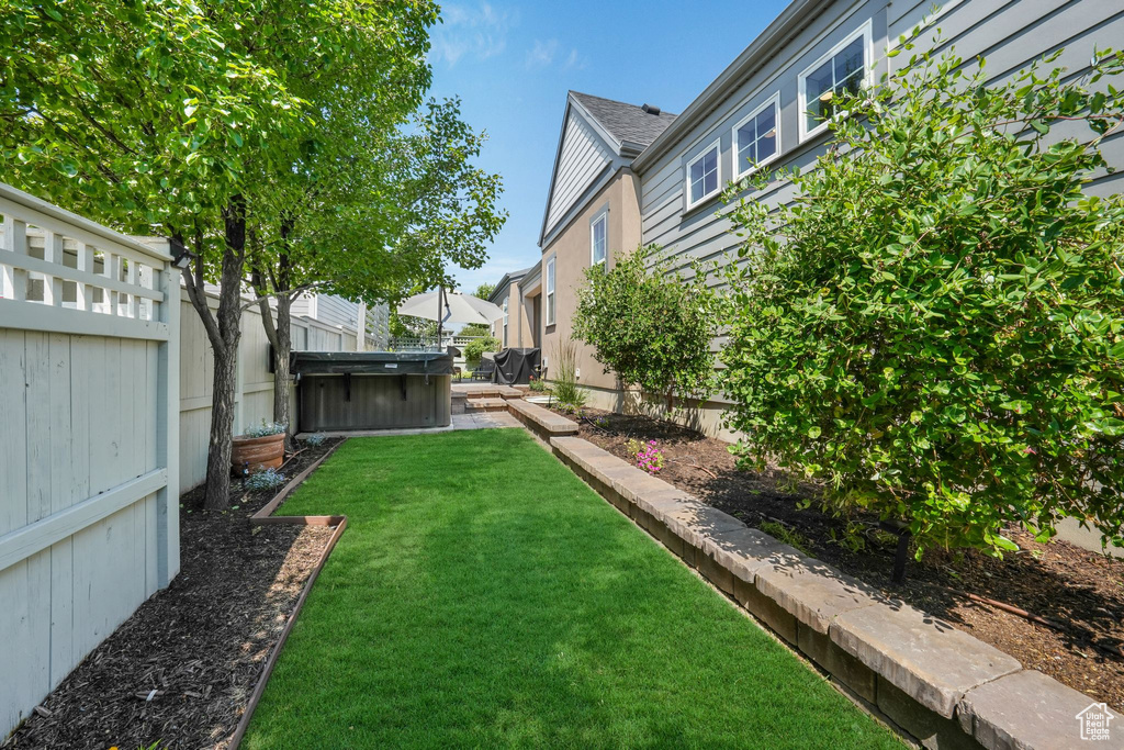 View of fenced backyard