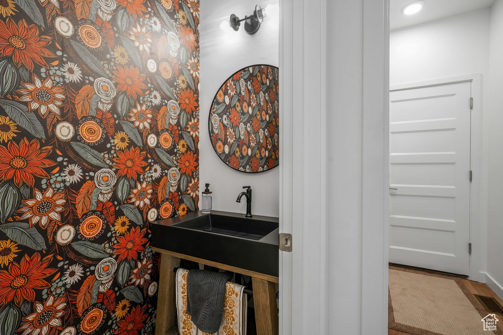 Bathroom with a sink and recessed lighting