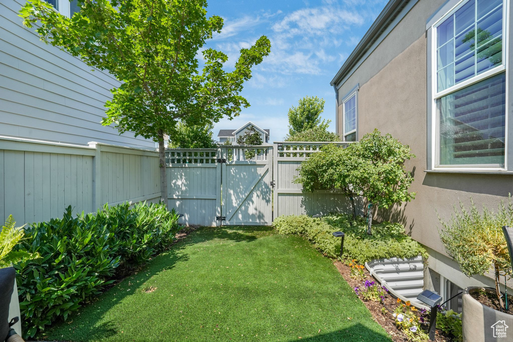 View of yard featuring a gate