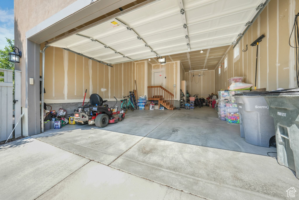 Garage featuring a garage door opener