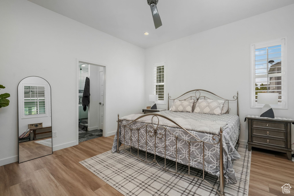 Bedroom with wood finished floors, recessed lighting, and ceiling fan