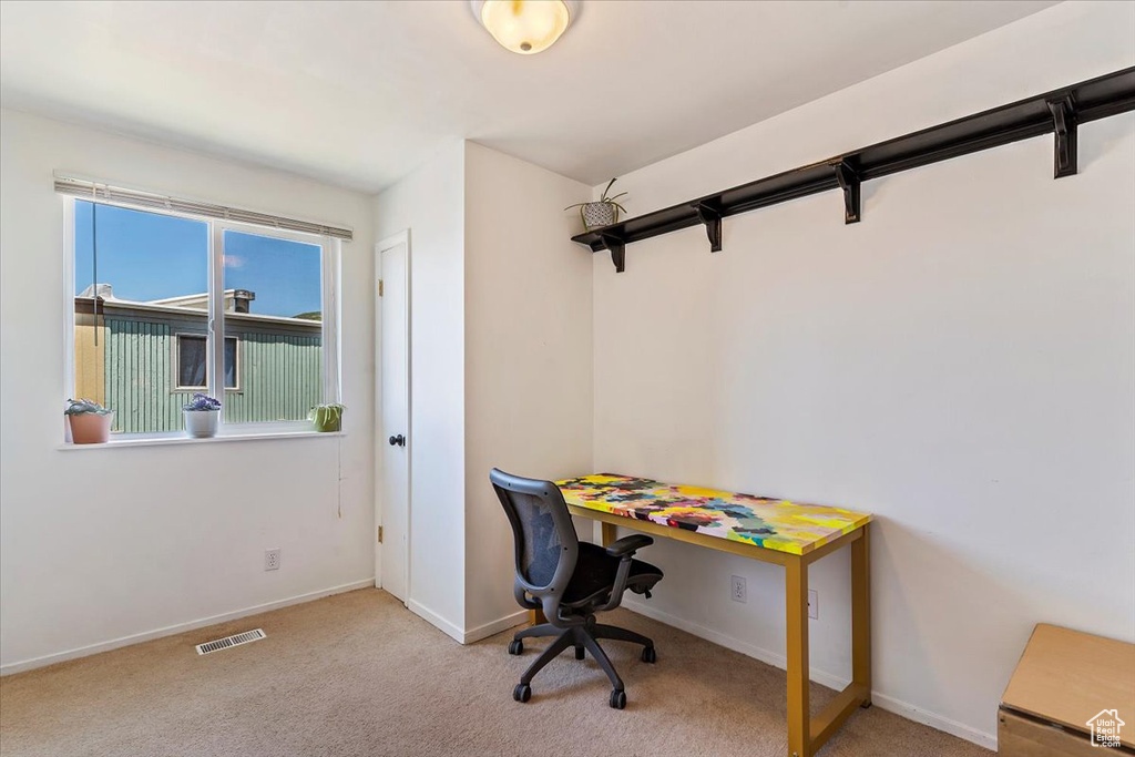 Office area featuring carpet flooring and baseboards