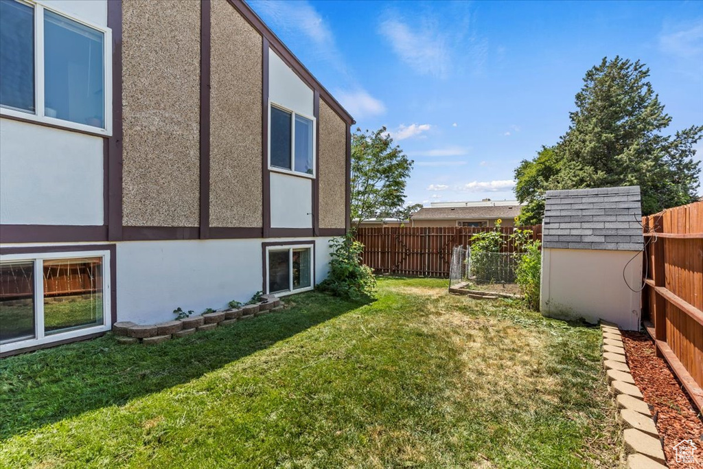 Fenced backyard with a shed