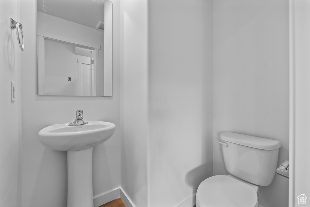 Bathroom featuring toilet and a sink