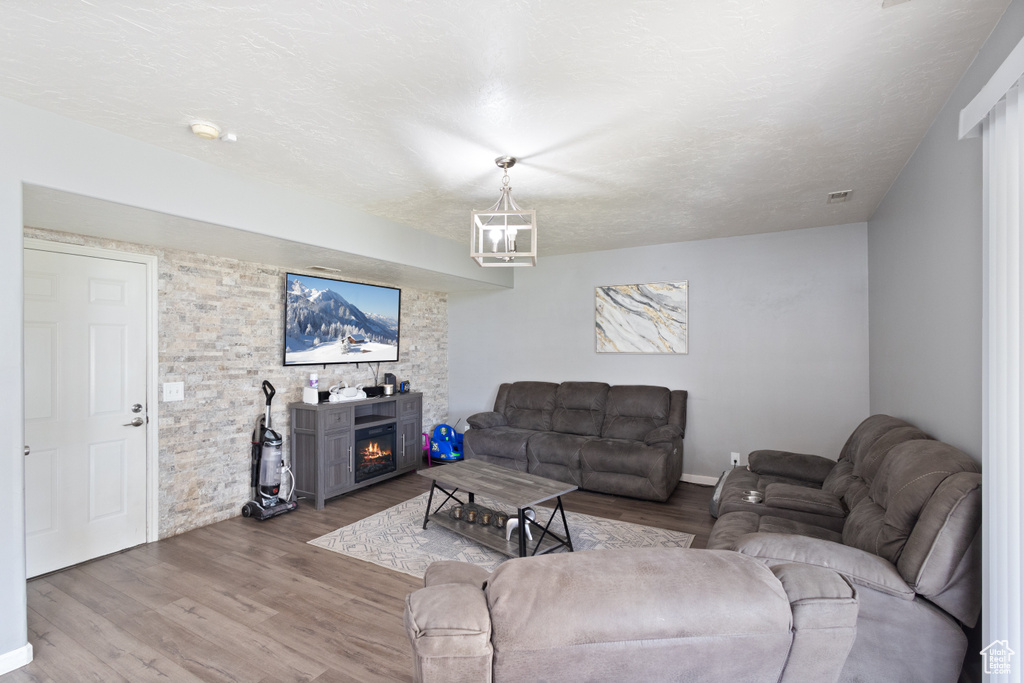 Living area featuring wood finished floors and a fireplace