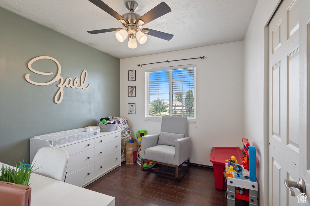 Bedroom featuring dark wood-style floors and a ceiling fan