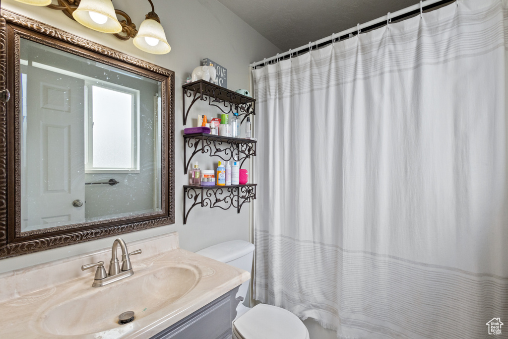 Bathroom featuring vanity and a shower with curtain
