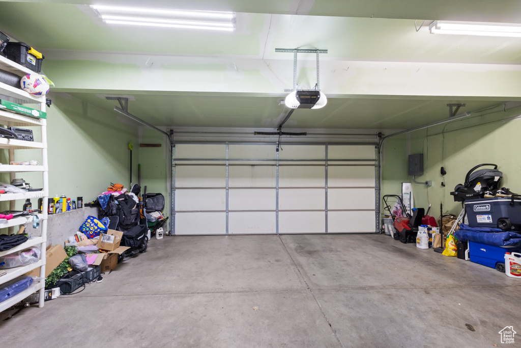 Garage featuring a garage door opener