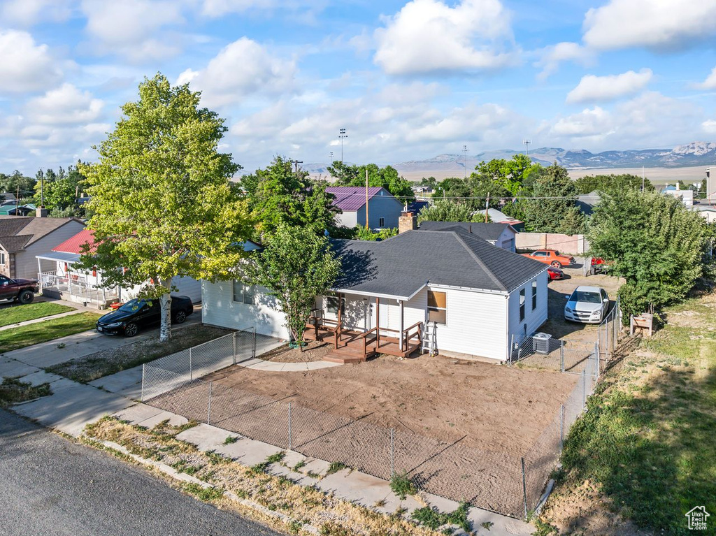Aerial view of residential area featuring mountains