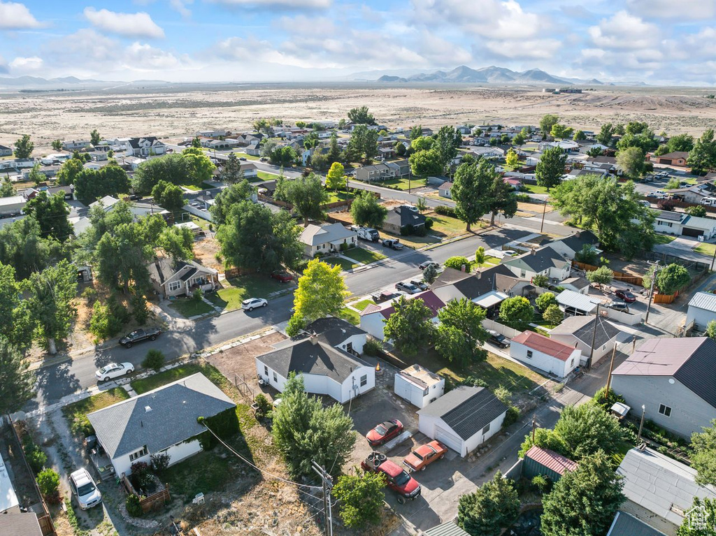Aerial perspective of suburban area featuring a mountainous background