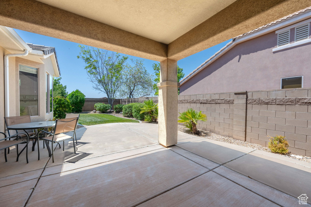 Fenced backyard with a patio area and outdoor dining space