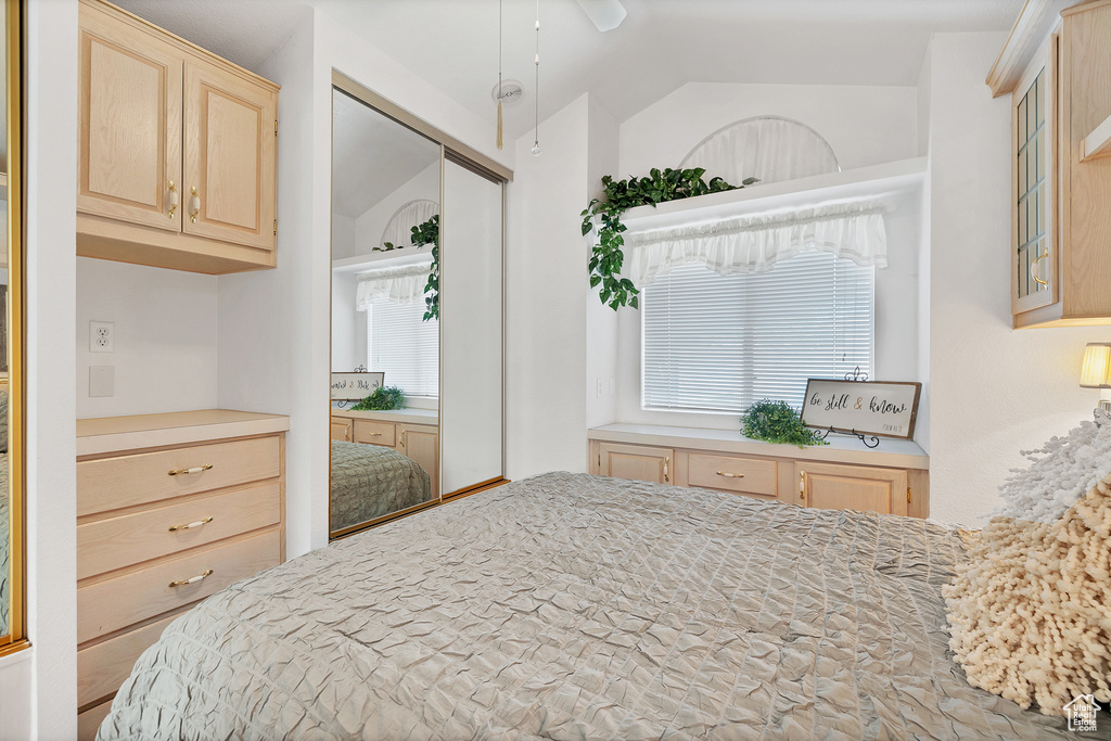 Bedroom with lofted ceiling