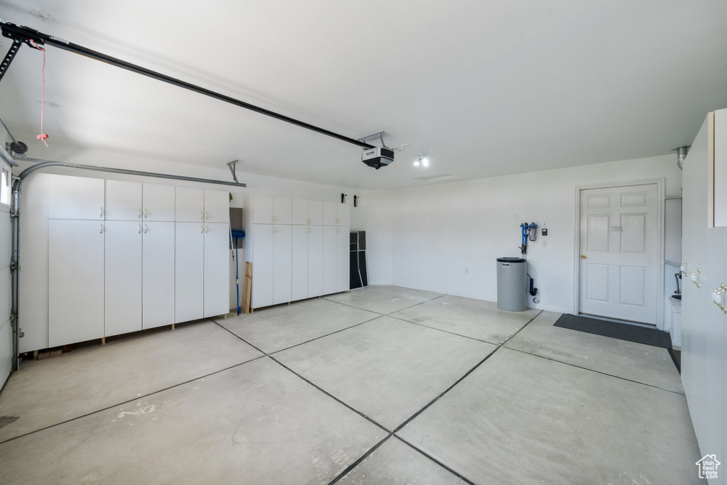 Garage featuring a garage door opener