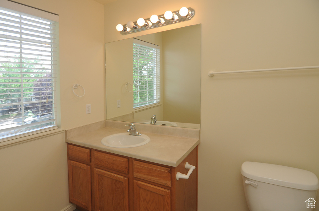 Bathroom featuring vanity and plenty of natural light