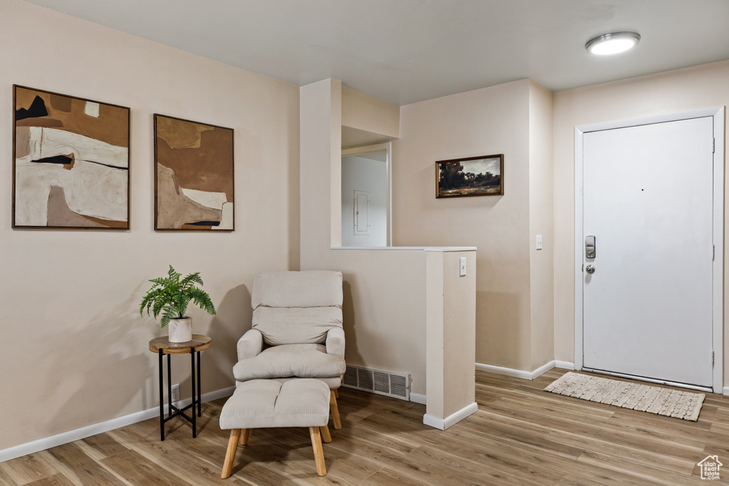 Sitting room with wood finished floors