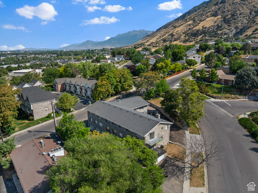 Aerial perspective of suburban area with a mountainous background