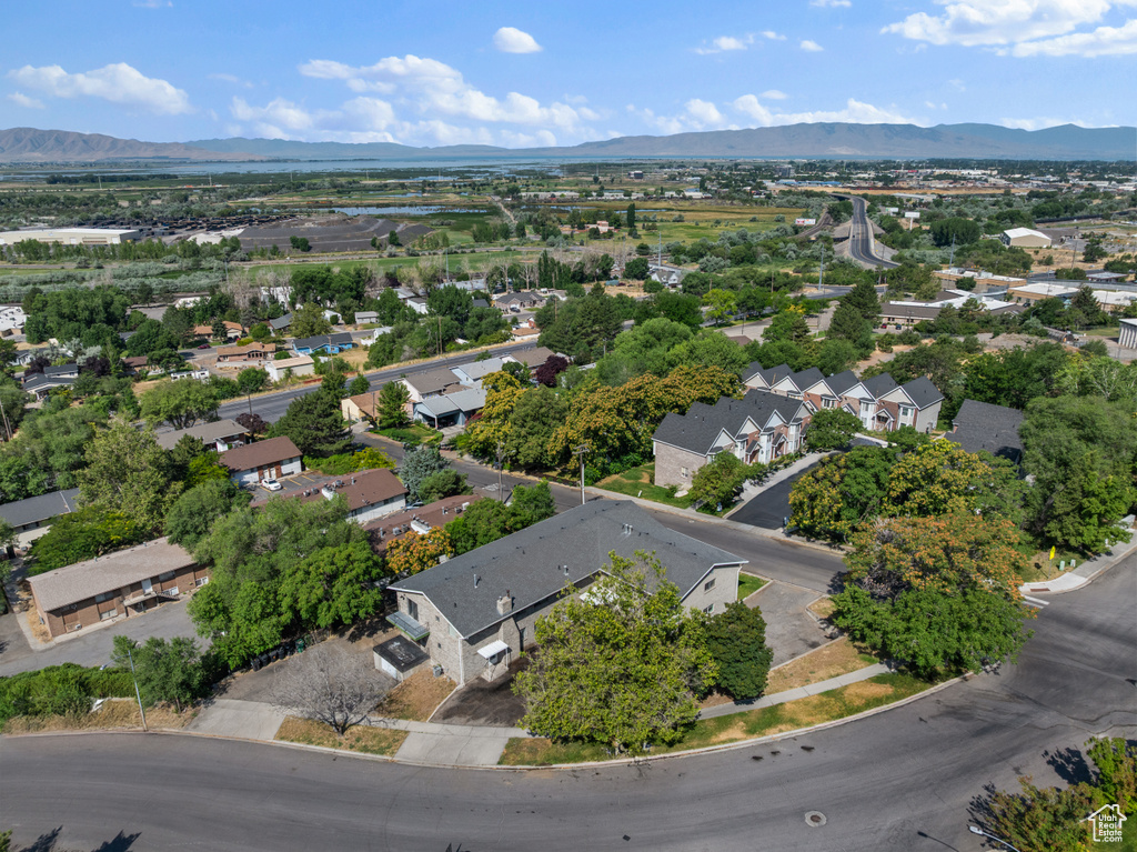 Aerial perspective of suburban area with a mountain backdrop