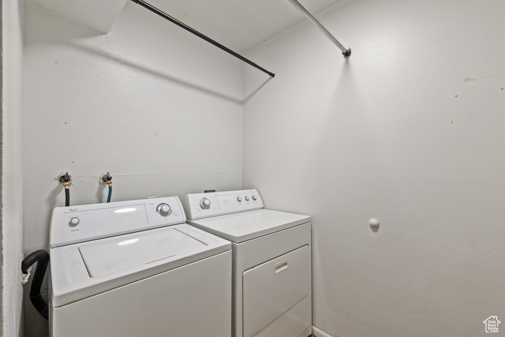 Laundry area with washing machine and clothes dryer
