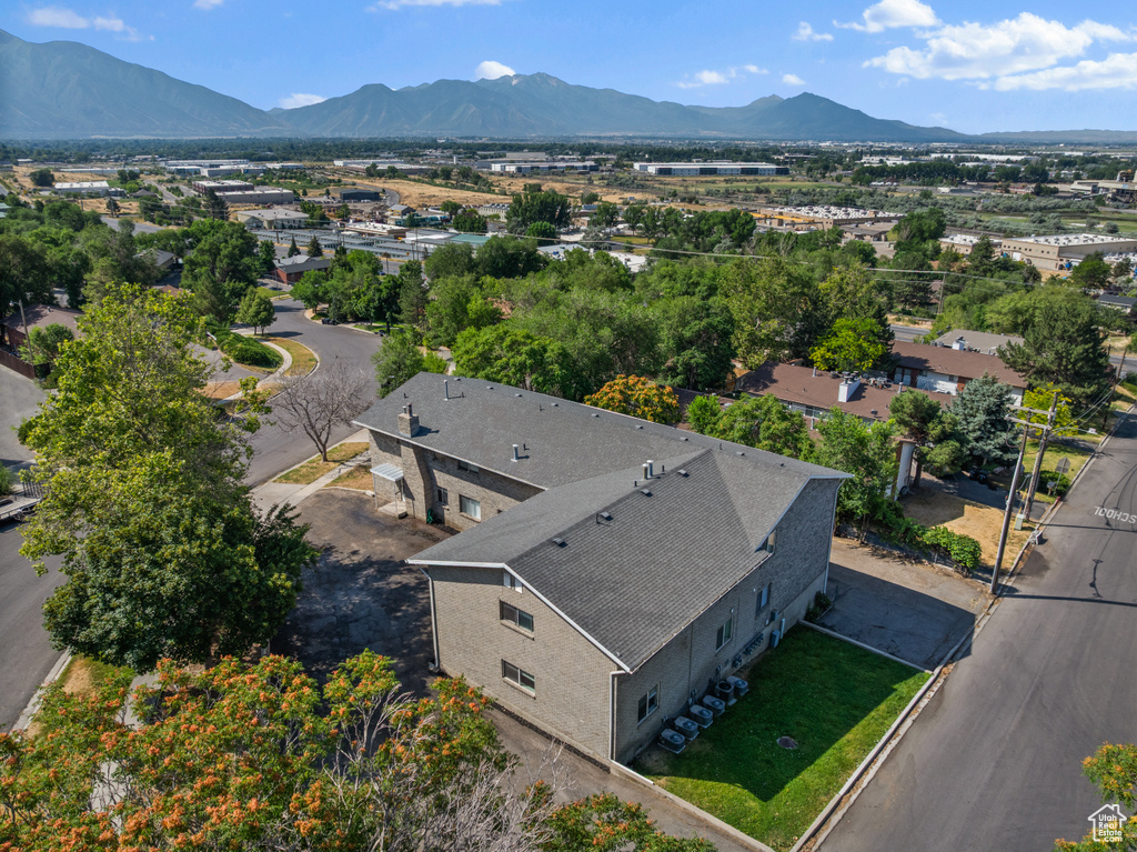 View of subject property featuring a mountainous background