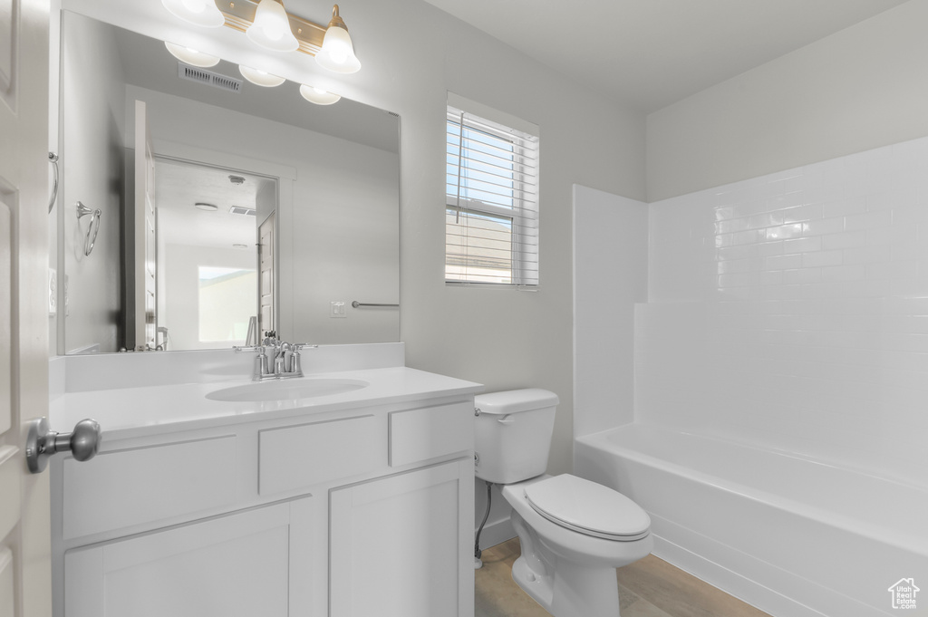 Full bathroom featuring vanity and bathing tub / shower combination