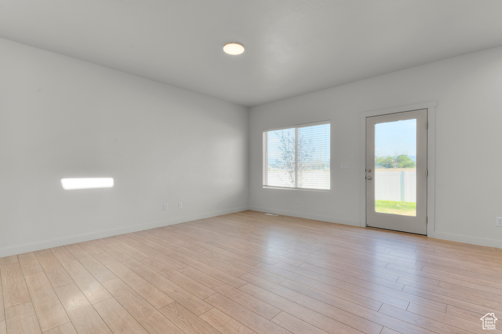 Unfurnished room with light wood-type flooring